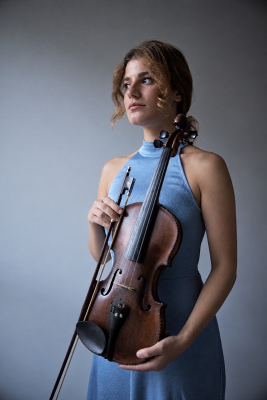 Portrait in a blue dress holding the violin